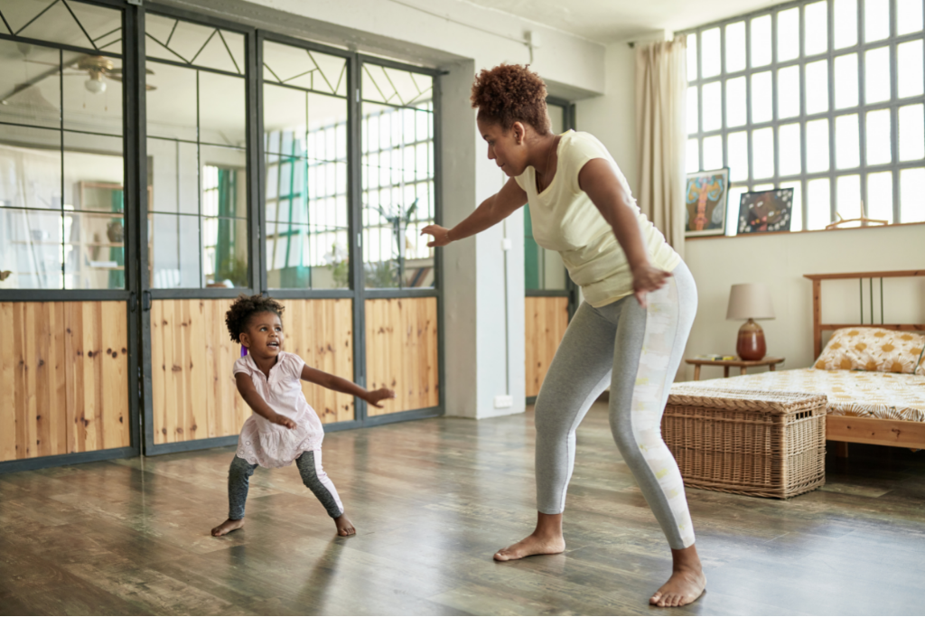 aba therapy interventions contextual fit in goal setting_KNR Therapy blog featured image_young girl and mom dancing in house